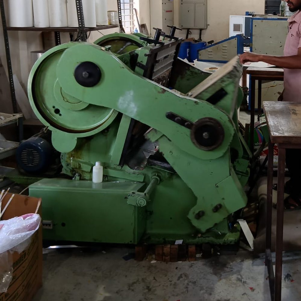 Platen die punching press being fed by hand at the Perundurai plant