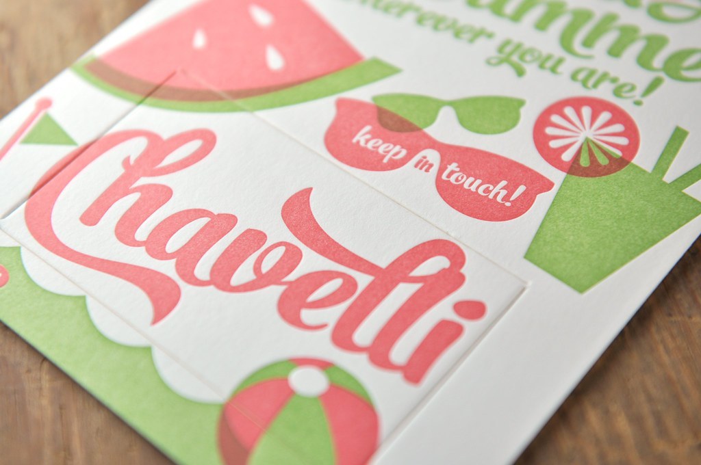 Close view of an embossed logo raised into matte laminated carton board